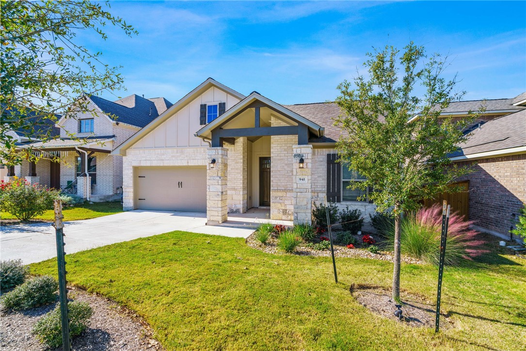 941 Del Raphael Drive Leander, TX 78641 - Photo 3 of 33 A wide driveway and neat landscaping frame this Palmera Ridge home, setting a great tone before you even step inside