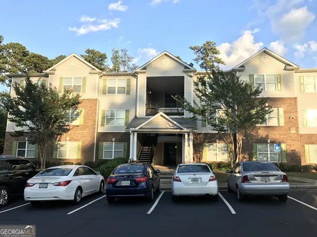 a view of a car parked in front of a houses