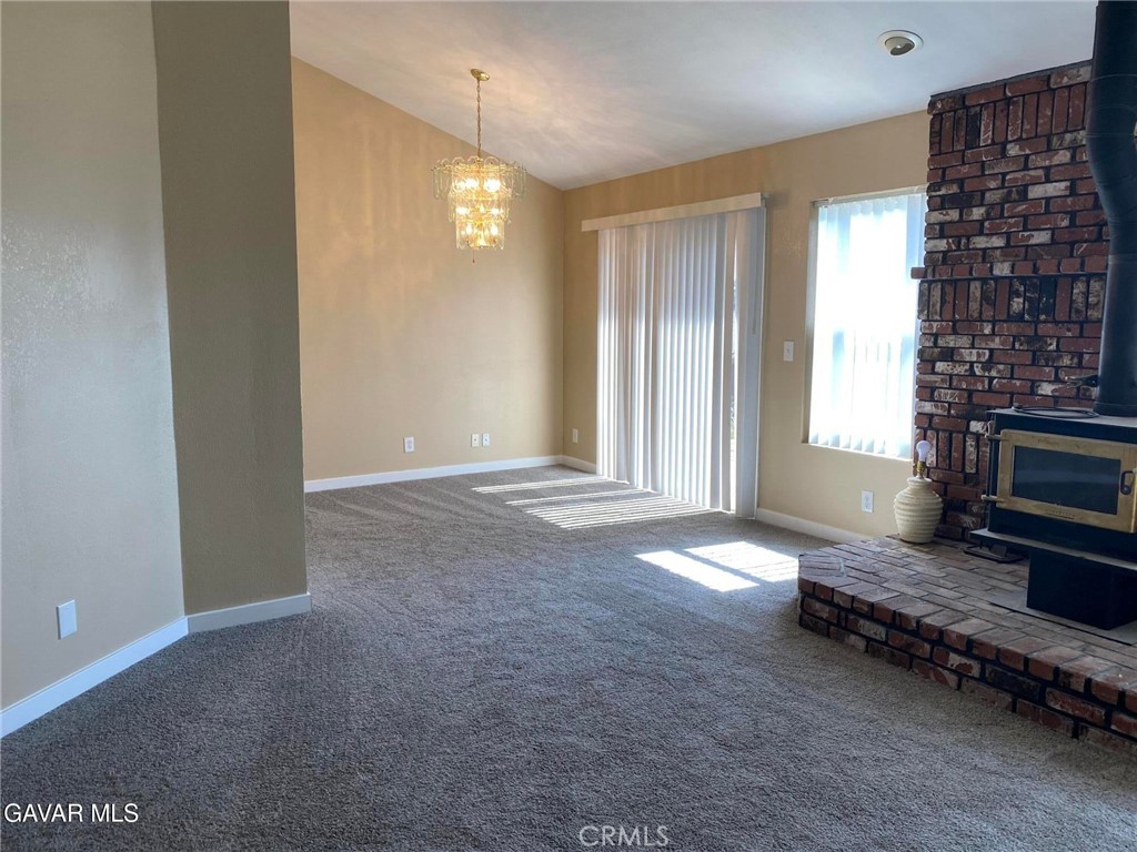 22601 Player Court Tehachapi, CA 93561 - Photo 7 of 10 a view of livingroom with hardwood floor and a ceiling fan
