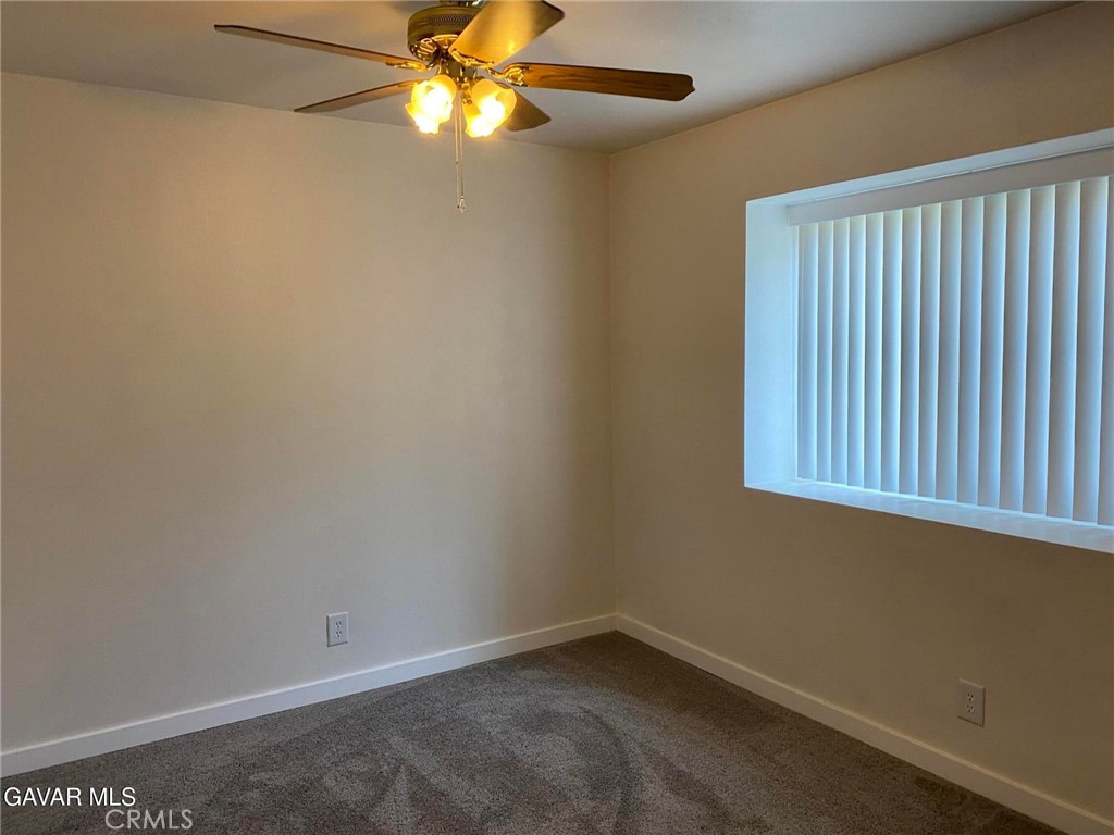 22601 Player Court Tehachapi, CA 93561 - Photo 8 of 10 an empty room with a window and a fan