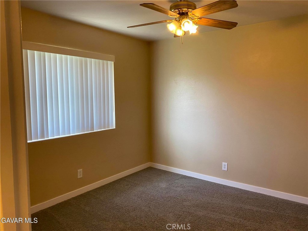 22601 Player Court Tehachapi, CA 93561 - Photo 9 of 10 an empty room with windows and fan
