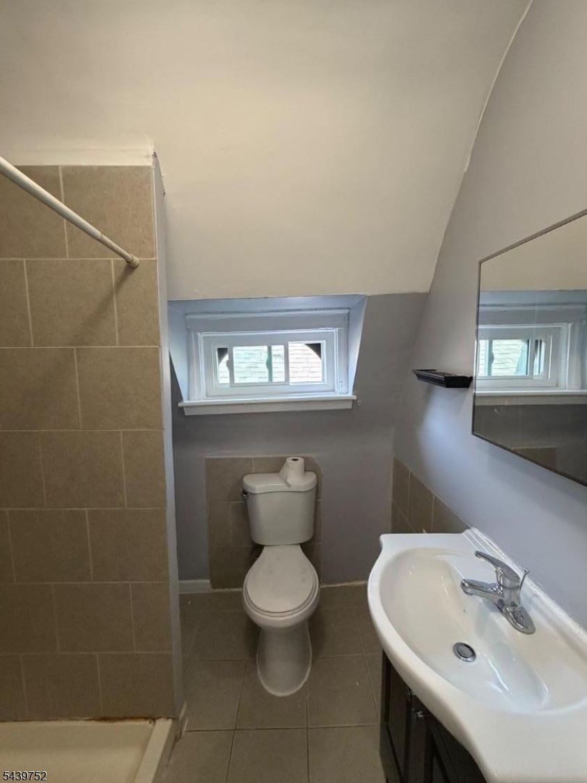 58 North 5th Street, Unit 3 Newark, NJ 07107 - Photo 4 of 11 a bathroom with a toilet sink and mirror