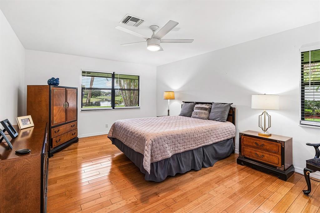 10158 Southeast Acorn Way Jupiter, FL 33469 - Photo 13 of 39 a bedroom with bed and window