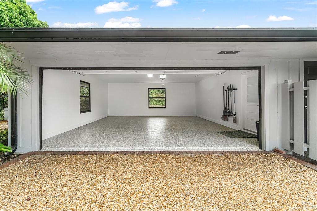 10158 Southeast Acorn Way Jupiter, FL 33469 - Photo 29 of 39 a view of a hallway with wooden floor and a window