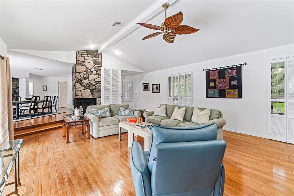 10158 Southeast Acorn Way Jupiter, FL 33469 - Photo 3 of 39 a living room with furniture and a wooden floor