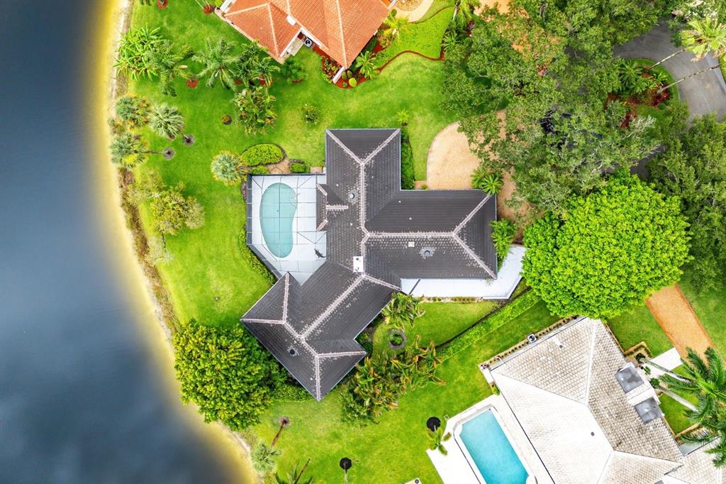 10158 Southeast Acorn Way Jupiter, FL 33469 - Photo 32 of 39 an aerial view of a house with swimming pool garden and patio