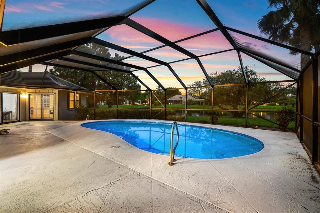 10158 Southeast Acorn Way Jupiter, FL 33469 - Photo 36 of 39 a view of a swimming pool with a patio
