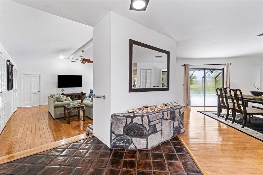 10158 Southeast Acorn Way Jupiter, FL 33469 - Photo 8 of 39 a living room with furniture and a flat screen tv
