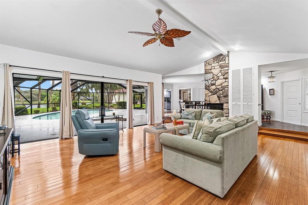 10158 Southeast Acorn Way Jupiter, FL 33469 - Photo 9 of 39 a living room with furniture and a large window