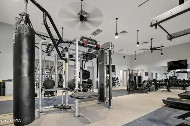 a view of a room with lots of gym equipment