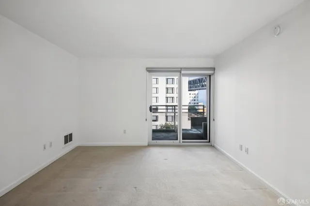 an empty room with water view