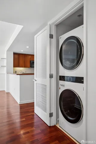 a view of a hallway with washer and dryer