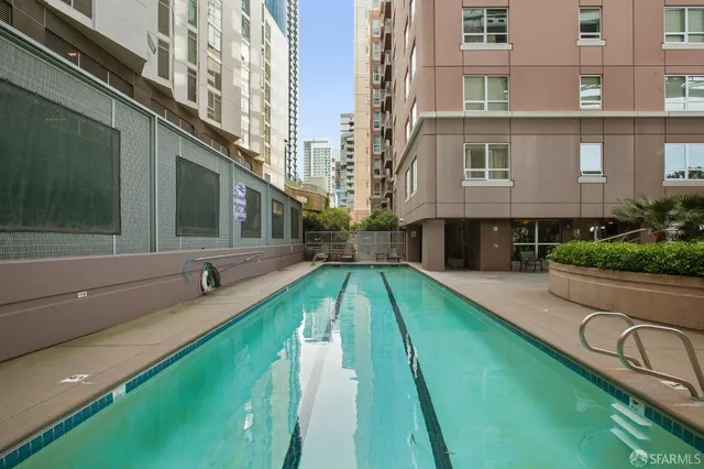 a view of a swimming pool with a lounge chairs