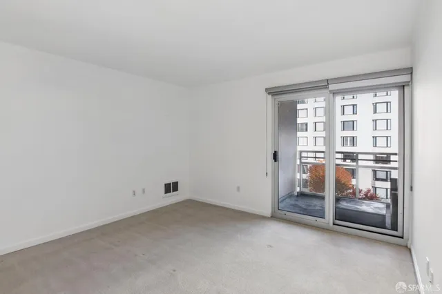 an empty room with glass door