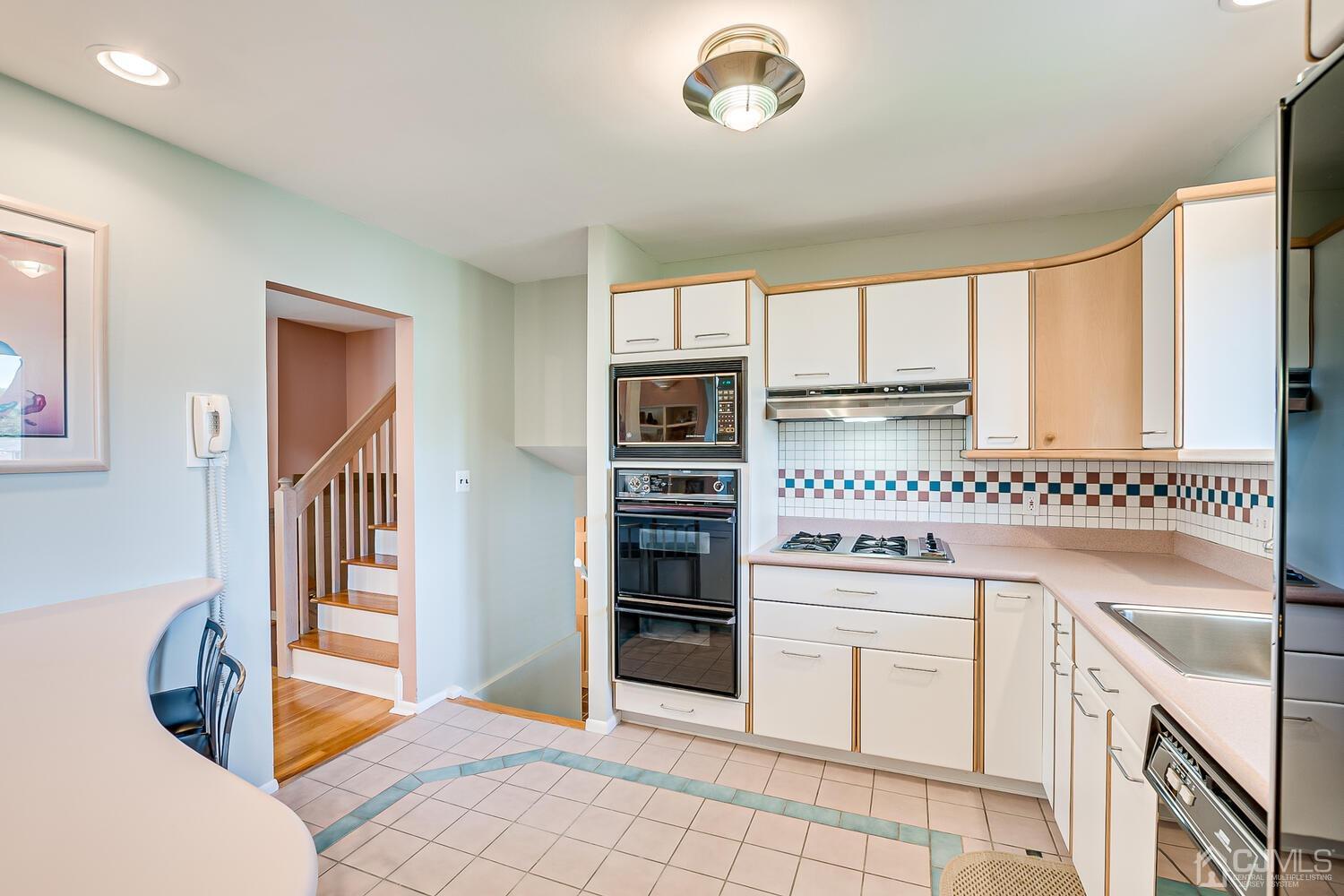20 Rieder Road Edison, NJ 08817 - Photo 19 of 40 a kitchen with stainless steel appliances granite countertop a stove and a refrigerator
