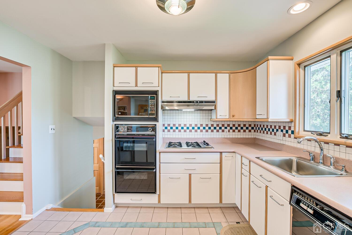 20 Rieder Road Edison, NJ 08817 - Photo 20 of 40 a kitchen with a sink stove and cabinets