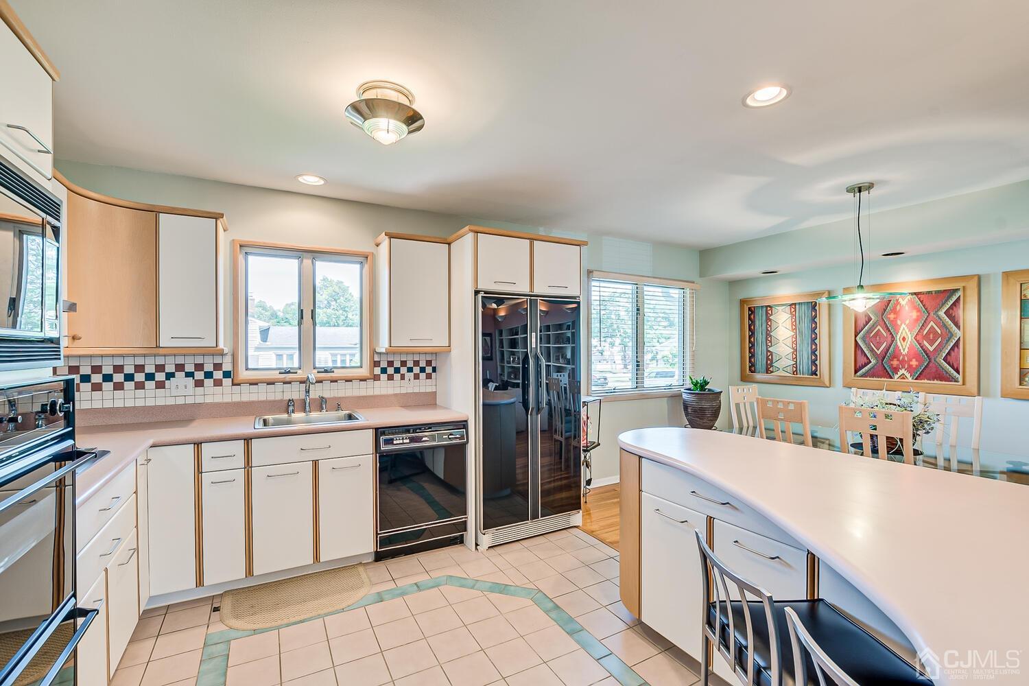 20 Rieder Road Edison, NJ 08817 - Photo 21 of 40 a kitchen with stainless steel appliances granite countertop a sink and cabinets