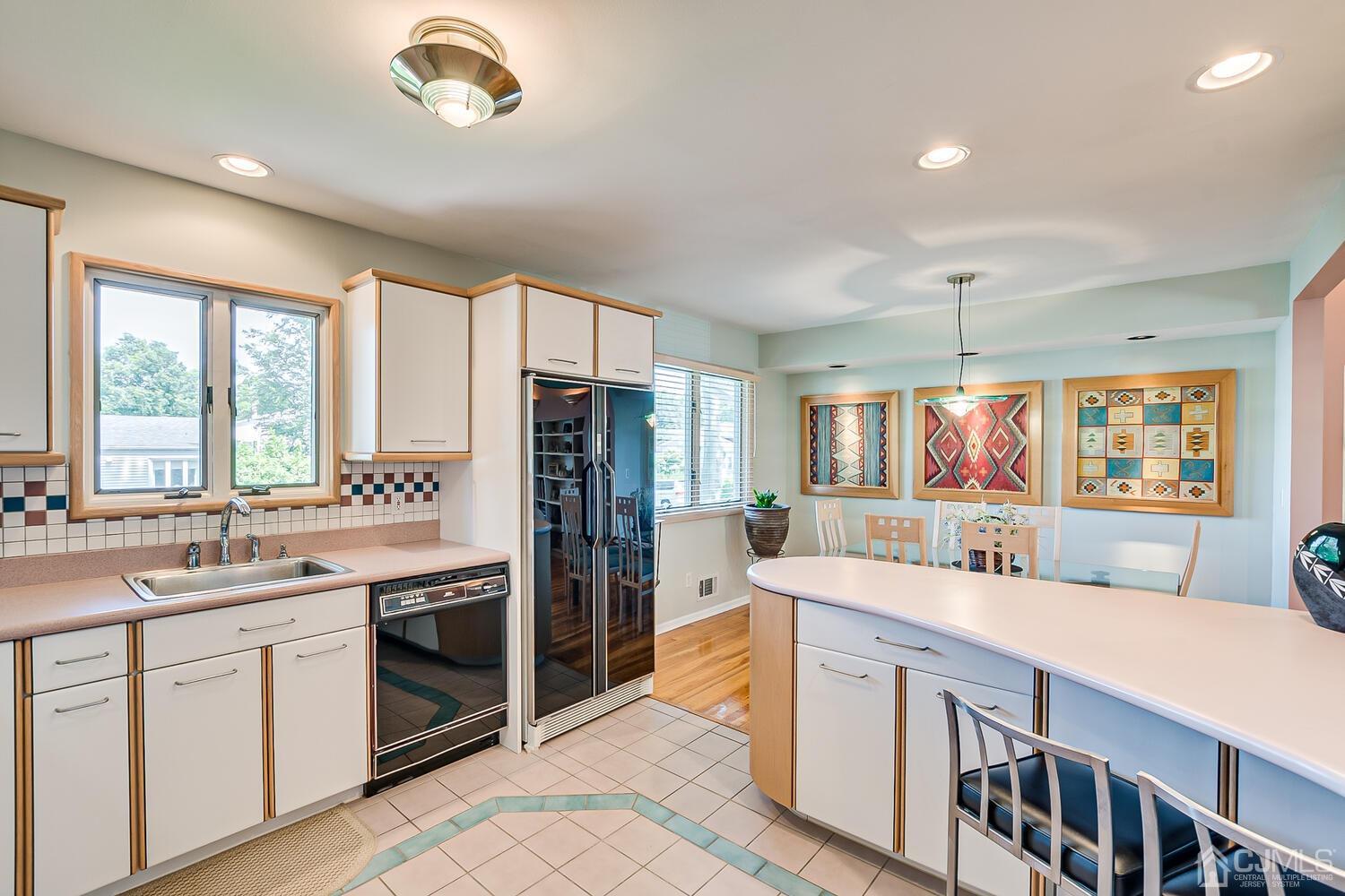 20 Rieder Road Edison, NJ 08817 - Photo 22 of 40 a kitchen with stainless steel appliances a sink stove and cabinets