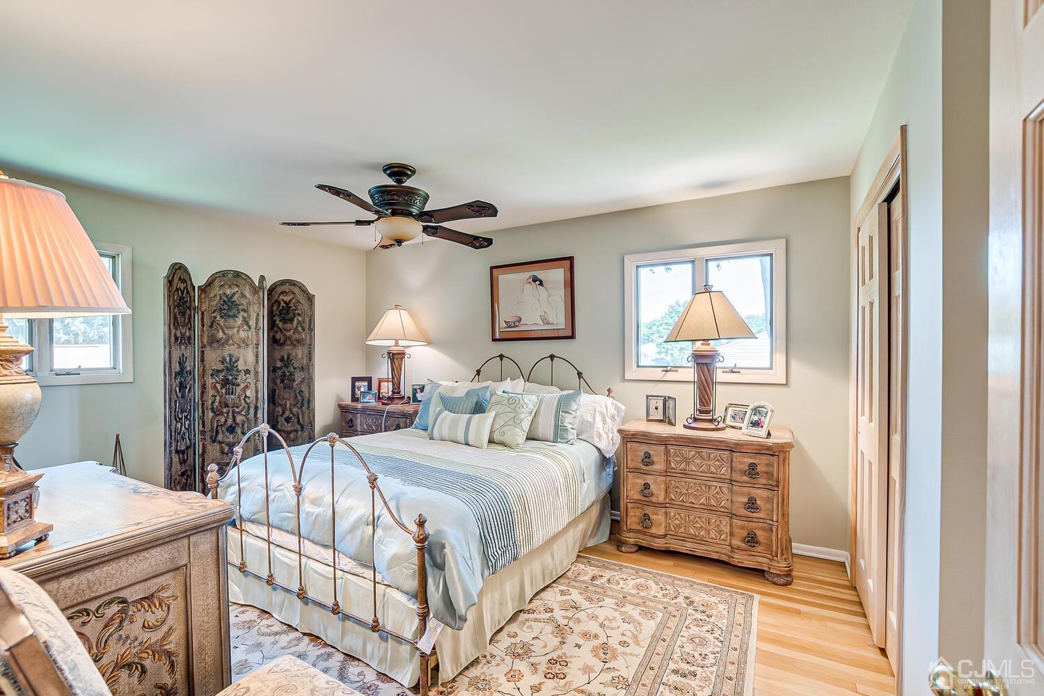 20 Rieder Road Edison, NJ 08817 - Photo 28 of 40 a bedroom with a bed and a chandelier