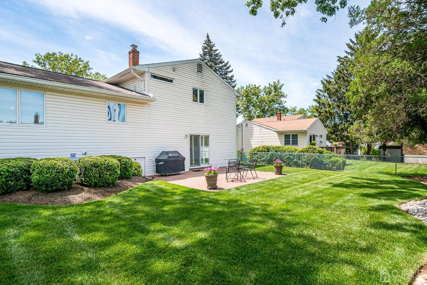 20 Rieder Road Edison, NJ 08817 - Photo 38 of 40 a view of a house with a yard and sitting area