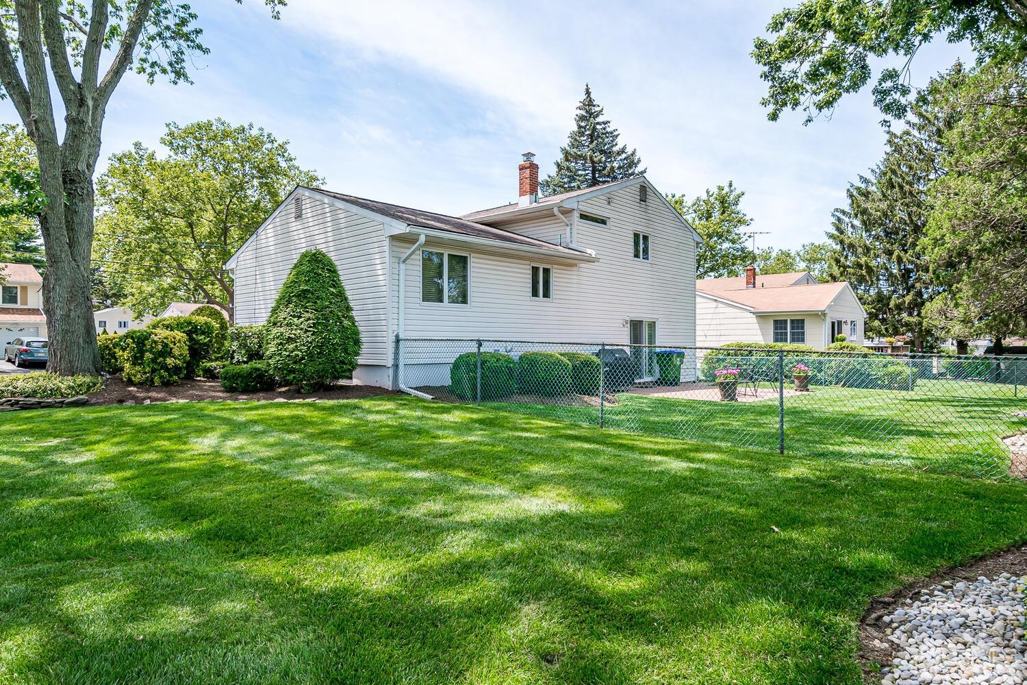 20 Rieder Road Edison, NJ 08817 - Photo 40 of 40 a front view of a house with a garden and trees