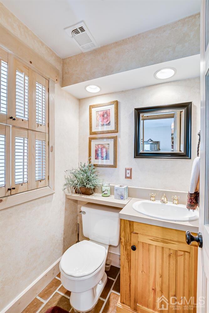 20 Rieder Road Edison, NJ 08817 - Photo 9 of 40 a bathroom with a toilet a sink and a window