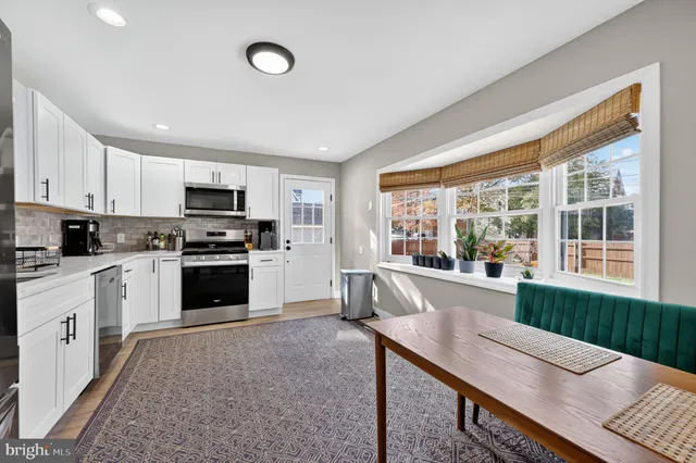 a kitchen with furniture and windows