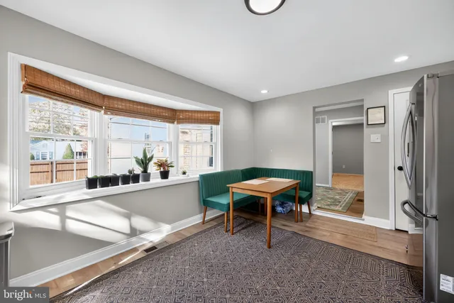 a view of a workspace with furniture and a potted plant
