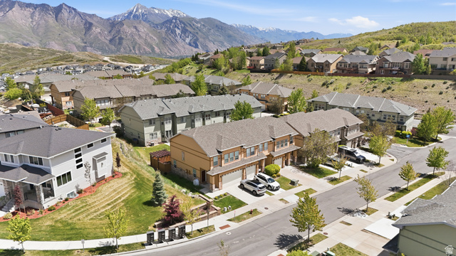 14771 Haddington Road Draper, UT 84020 - Photo 34 of 44 Expansive mountain range backdrop featuring residential properties, paved streets, and landscaped yards