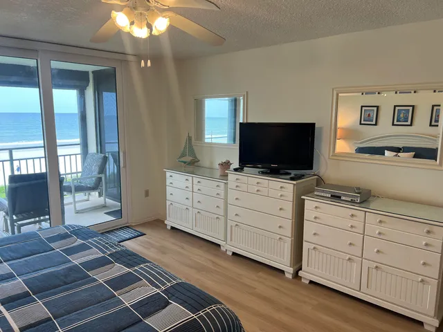 a room with furniture and flat screen tv