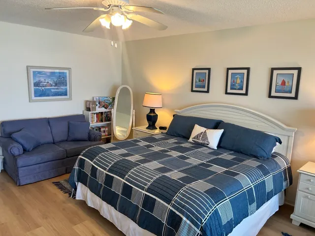 a bed room with a bed and a couch