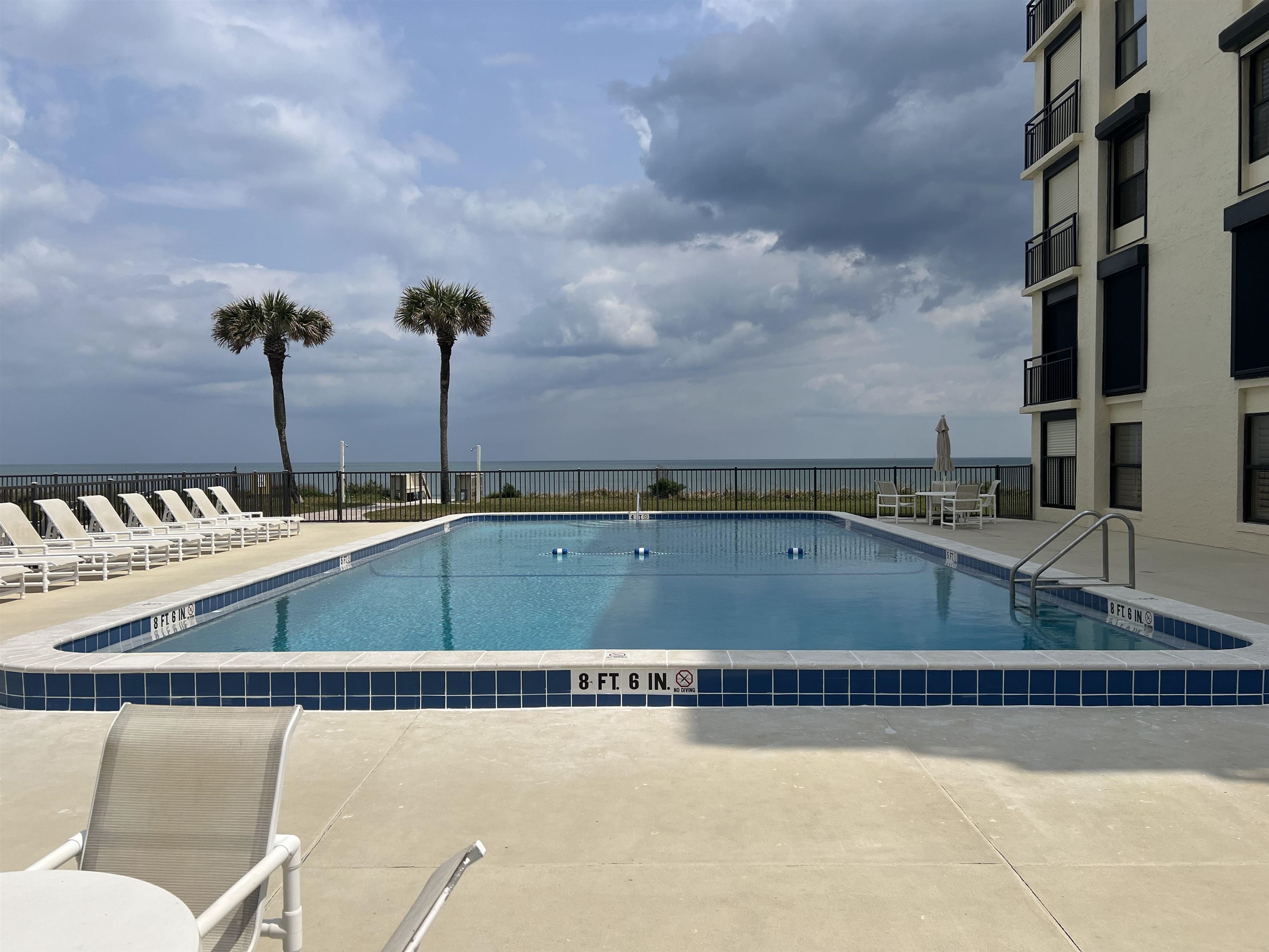 8050 A1A South St. Augustine, FL 32080 - Photo 19 of 25 a view of a swimming pool and a chair