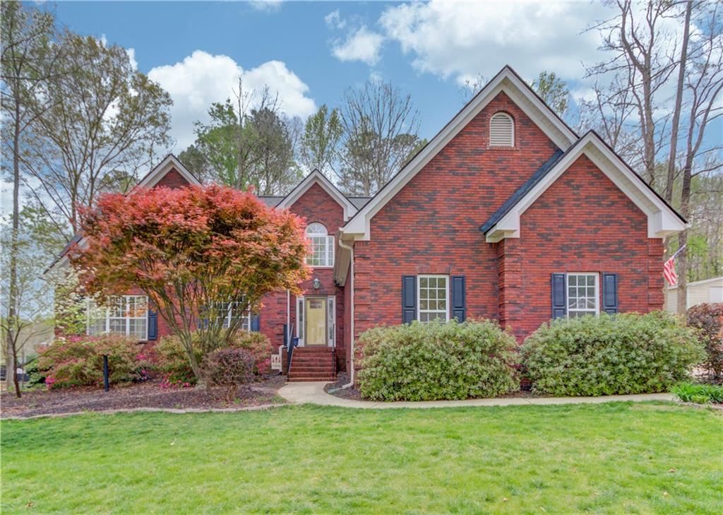 a front view of a house with a yard