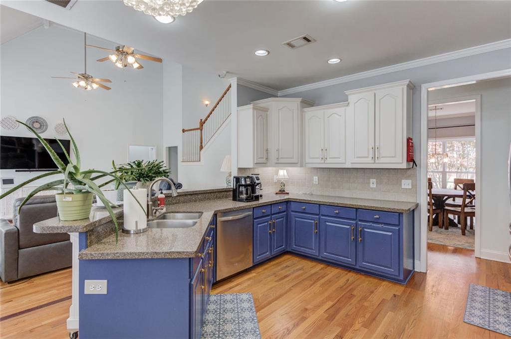 124 Dumar Lane Hoschton, GA 30548 - Photo 13 of 49 a kitchen with stainless steel appliances granite countertop sink stove and cabinets