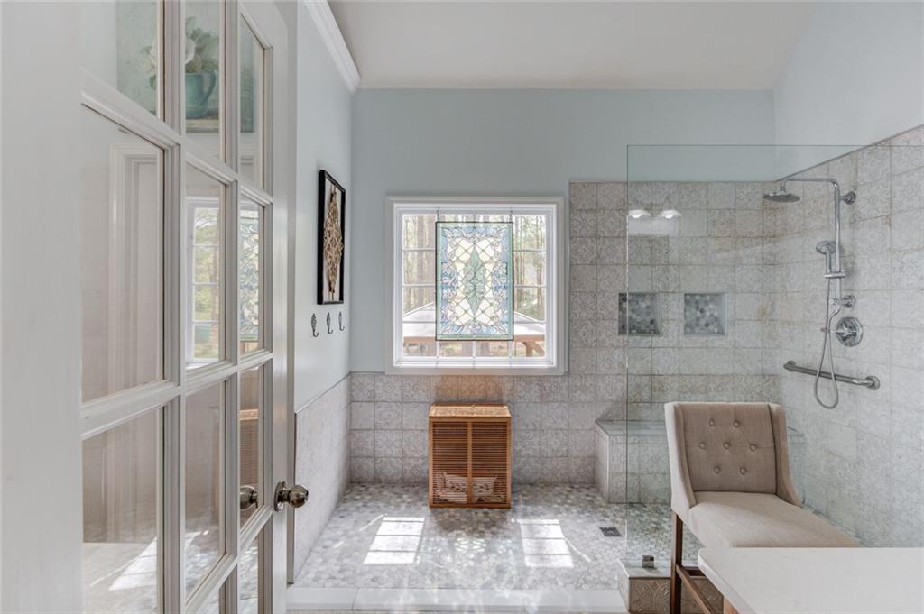 124 Dumar Lane Hoschton, GA 30548 - Photo 17 of 49 a bathroom with a toilet and shower