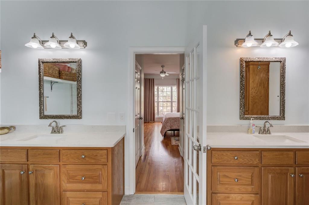 124 Dumar Lane Hoschton, GA 30548 - Photo 19 of 49 a en suite bathroom with a sink double vanity and a mirror