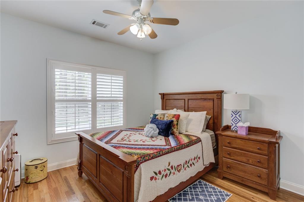 124 Dumar Lane Hoschton, GA 30548 - Photo 23 of 49 a bed sitting in a bedroom next to a window