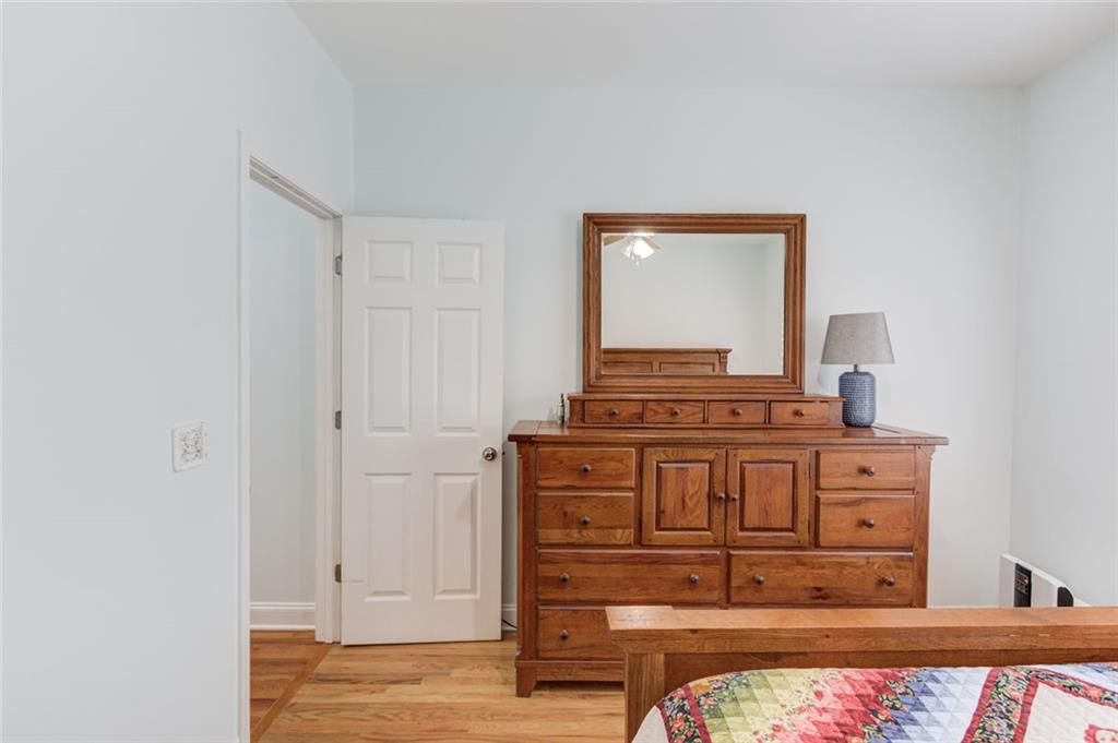 124 Dumar Lane Hoschton, GA 30548 - Photo 24 of 49 a view of a dresser with wooden floor