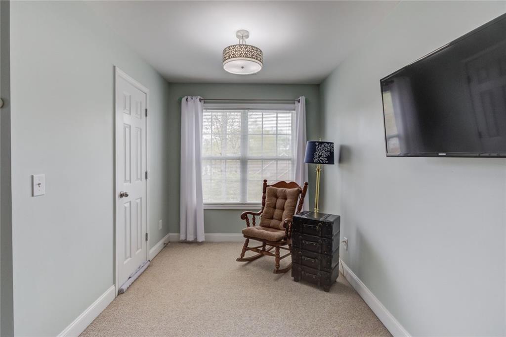 124 Dumar Lane Hoschton, GA 30548 - Photo 30 of 49 a view of a workspace with furniture and a window