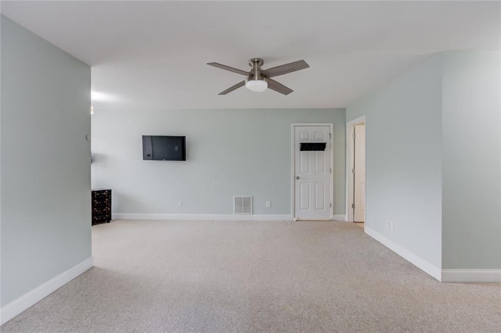 124 Dumar Lane Hoschton, GA 30548 - Photo 31 of 49 an empty room with closet and windows