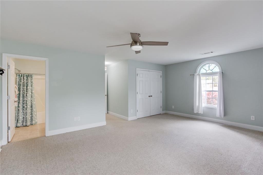 124 Dumar Lane Hoschton, GA 30548 - Photo 32 of 49 an empty room with windows and closet