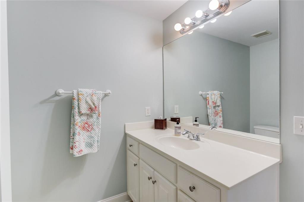 124 Dumar Lane Hoschton, GA 30548 - Photo 33 of 49 a bathroom with a sink vanity and a mirror