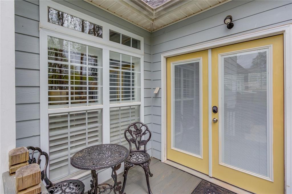 124 Dumar Lane Hoschton, GA 30548 - Photo 35 of 49 a view of a door and chair in the balcony