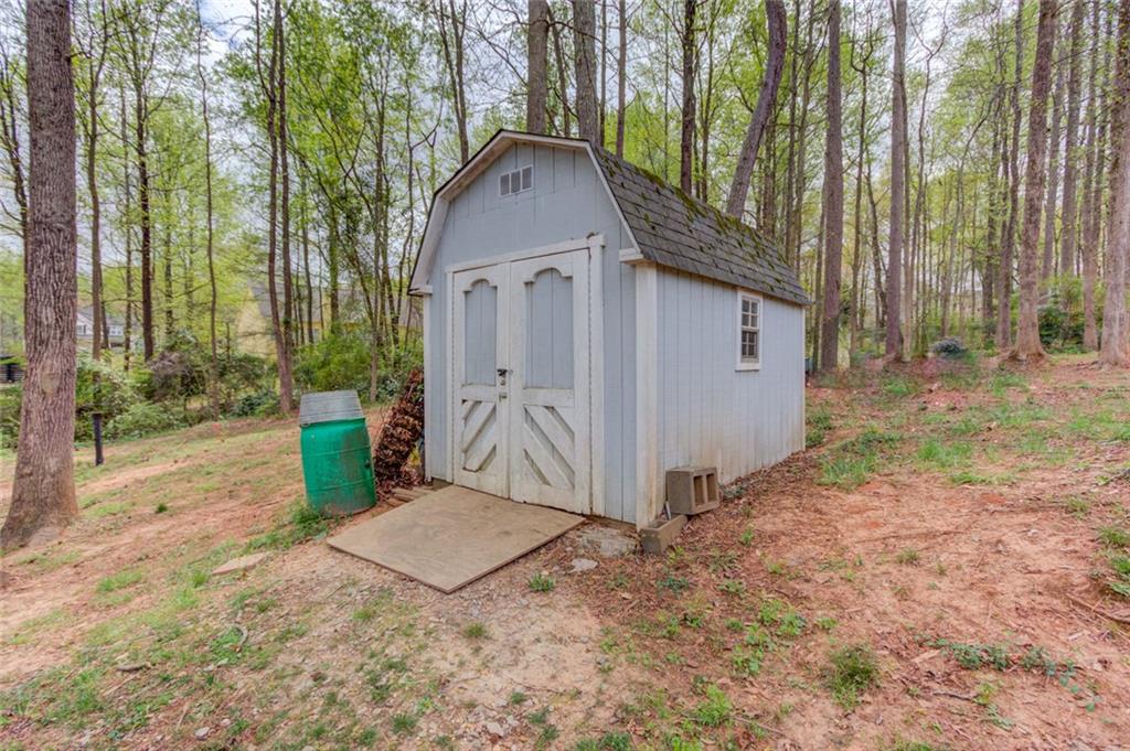 124 Dumar Lane Hoschton, GA 30548 - Photo 43 of 49 a front view of a house with garden