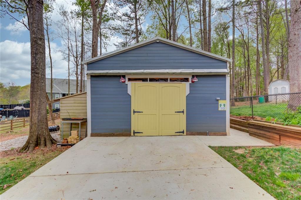 124 Dumar Lane Hoschton, GA 30548 - Photo 46 of 49 a front view of a house with a garden