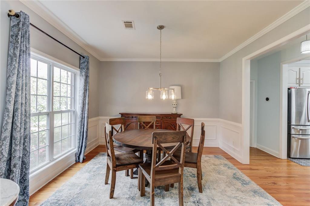 124 Dumar Lane Hoschton, GA 30548 - Photo 5 of 49 a view of a dining room with furniture window and wooden floor