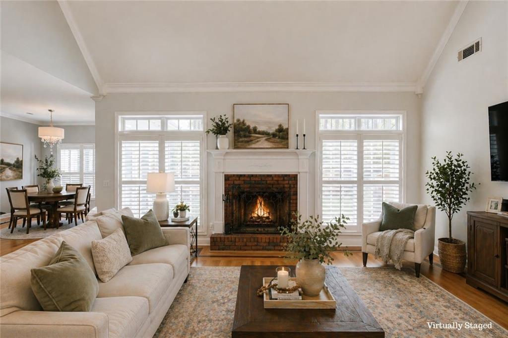 124 Dumar Lane Hoschton, GA 30548 - Photo 7 of 49 a living room with furniture and a fireplace