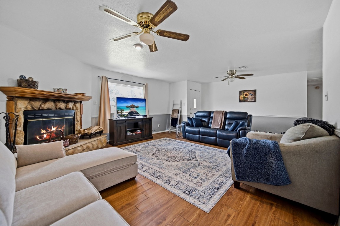 400 Dora Street Cleveland, TX 77328 - Photo 11 of 19 a living room with furniture and a fireplace