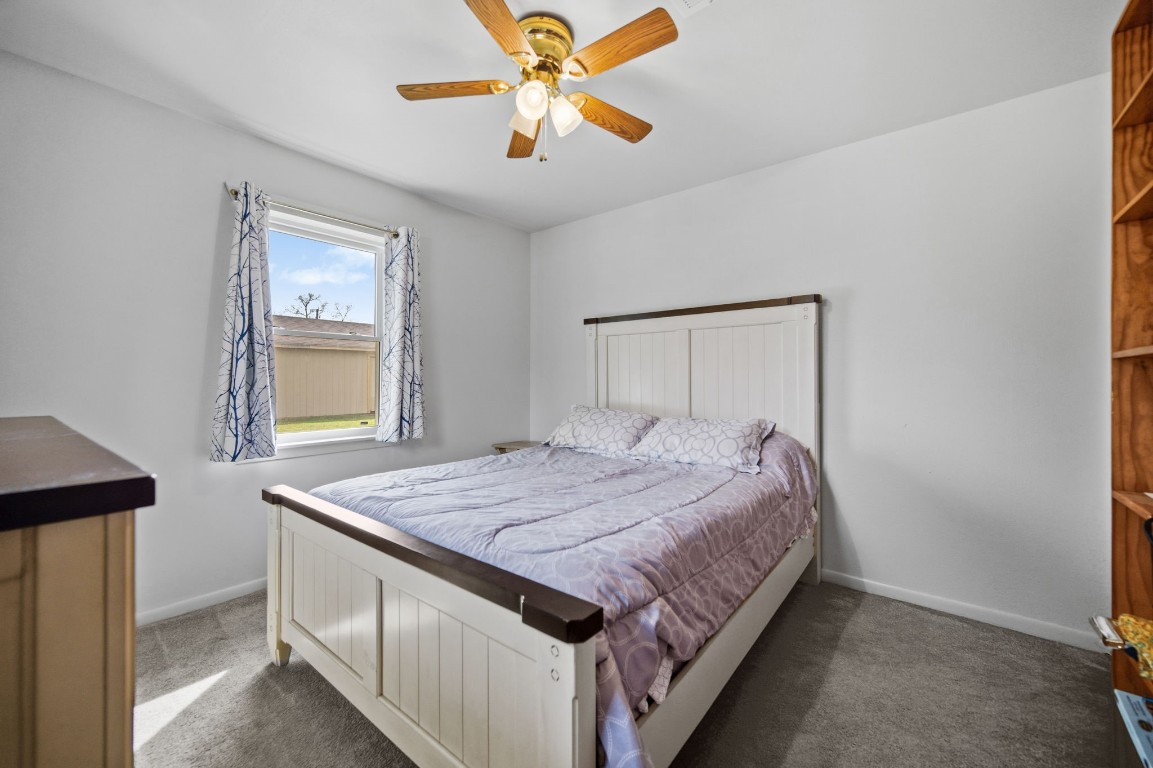 400 Dora Street Cleveland, TX 77328 - Photo 18 of 19 a bedroom with a bed and a window