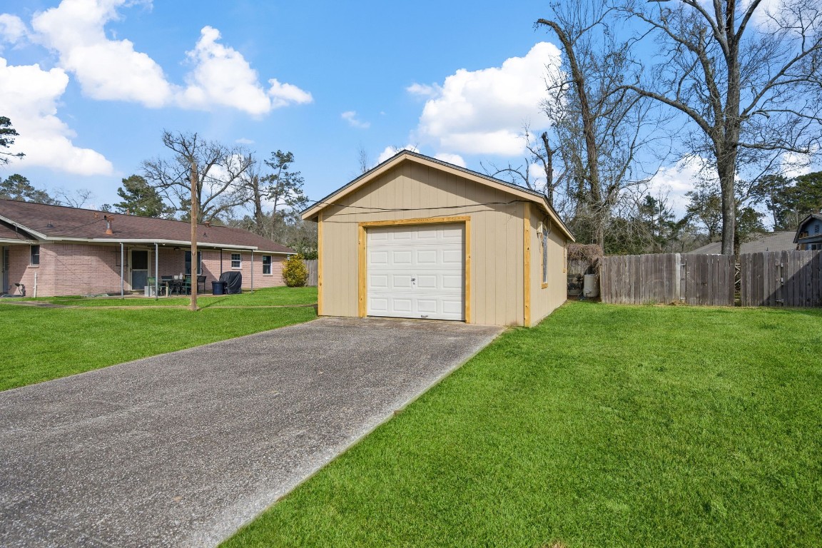 400 Dora Street Cleveland, TX 77328 - Photo 5 of 19 a front view of house with yard and green space